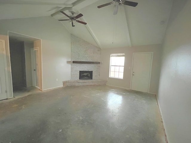 unfurnished living room featuring a ceiling fan, high vaulted ceiling, beam ceiling, a fireplace, and unfinished concrete flooring