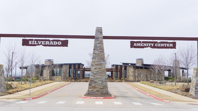 view of road with sidewalks and curbs