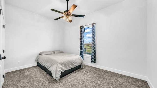 bedroom featuring carpet floors, ceiling fan, and baseboards