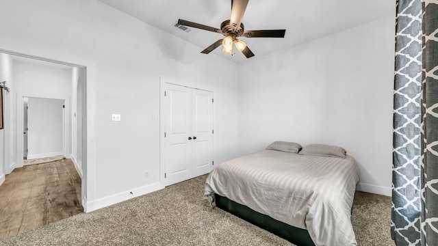 bedroom with a closet, visible vents, ceiling fan, and baseboards