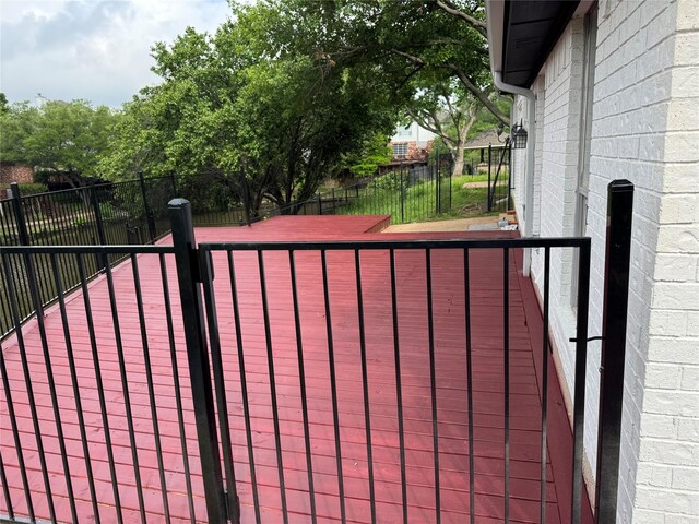 view of gate with a fenced backyard
