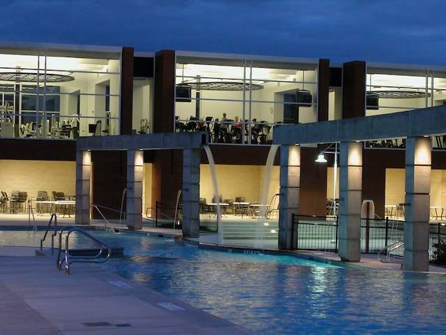 exterior space featuring a community pool and a patio area