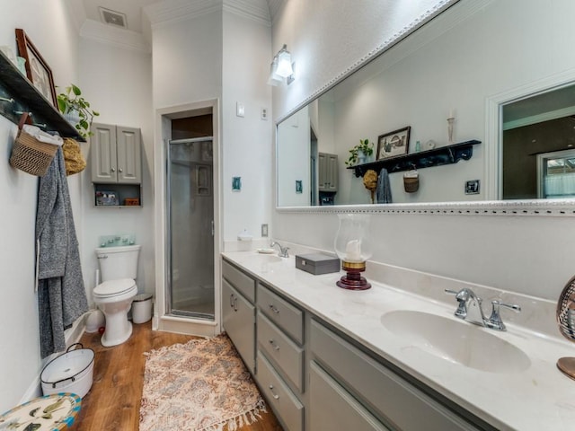 932 Williams St, Rockwall, TX 75087 - bathroom featuring crown molding, a stall shower, double vanity, and wood finished floors