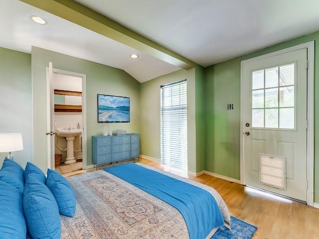 932 Williams St, Rockwall, TX 75087 - bedroom with wood finished floors, multiple windows, recessed lighting, vaulted ceiling, and connected bathroom