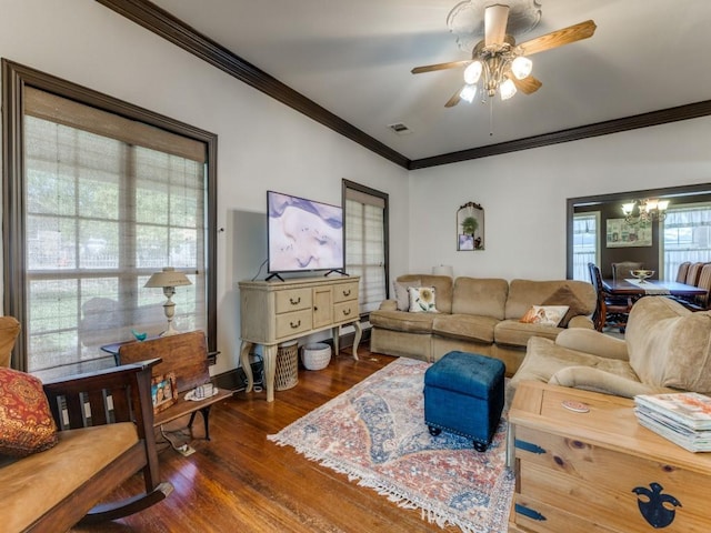 932 Williams St, Rockwall, TX 75087 - living room featuring ornamental molding, dark wood-style floors, a ceiling fan, and a chandelier