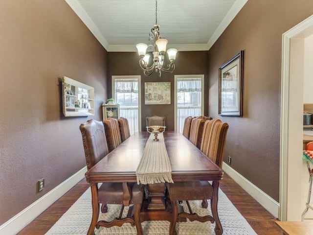 932 Williams St, Rockwall, TX 75087 - dining space with a chandelier, wood finished floors, and crown molding