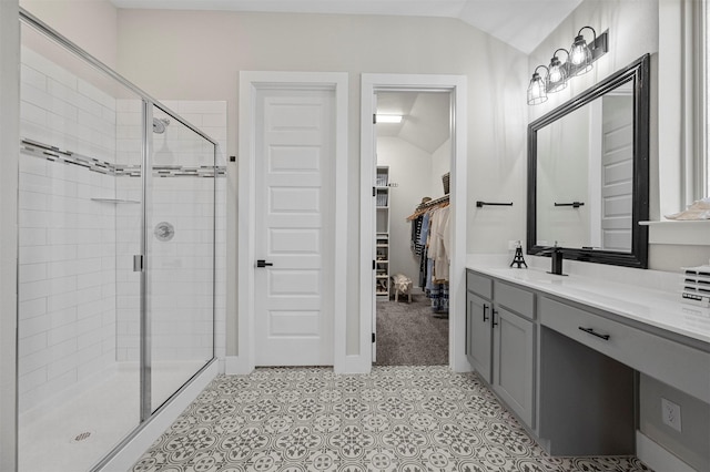 1840 Big Spring Dr, Forney, TX 75126 - bathroom with lofted ceiling, a shower stall, a spacious closet, and vanity