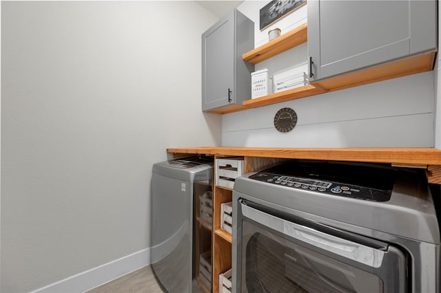 1840 Big Spring Dr, Forney, TX 75126 - washroom with cabinet space and independent washer and dryer