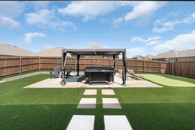 view of yard with a patio area, a fenced backyard, a gazebo, and a hot tub