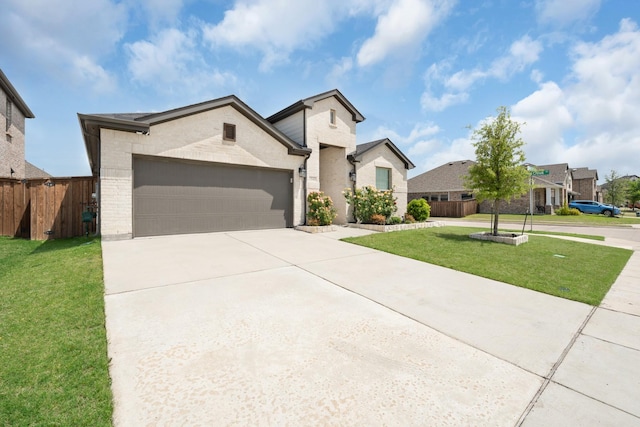 view of front of house with fence, a front lawn, an attached garage, driveway, and brick siding