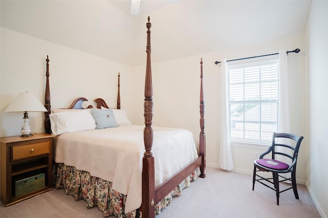 bedroom with baseboards and light carpet
