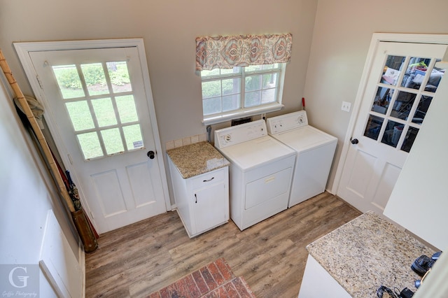 221 Summit Dr, Bossier City, LA 71111 - laundry room with cabinet space, washing machine and dryer, and light wood finished floors