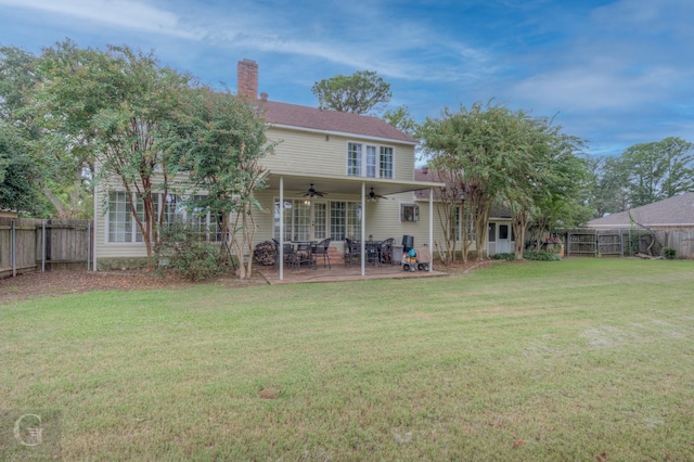 221 Summit Dr, Bossier City, LA 71111 - rear view of house featuring a lawn, a ceiling fan, a fenced backyard, a chimney, and a patio area