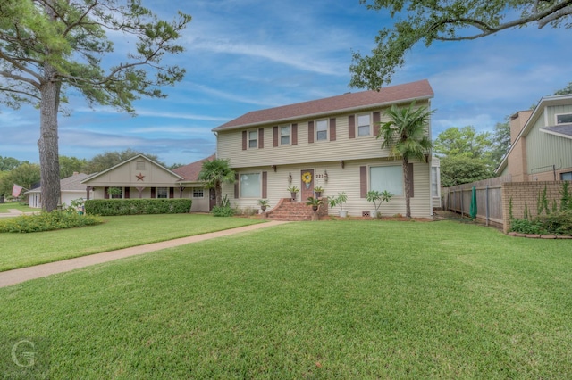 221 Summit Dr, Bossier City, LA 71111 - colonial inspired home featuring a front yard and fence