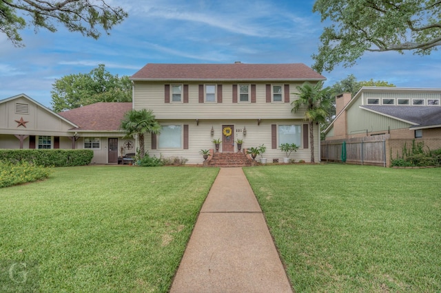 221 Summit Dr, Bossier City, LA 71111 - colonial-style house with a front lawn and fence
