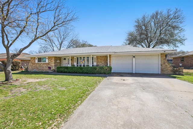 3433 Lawndale Ave, Fort Worth, TX 76133 - ranch-style home featuring a front lawn, an attached garage, brick siding, and concrete driveway