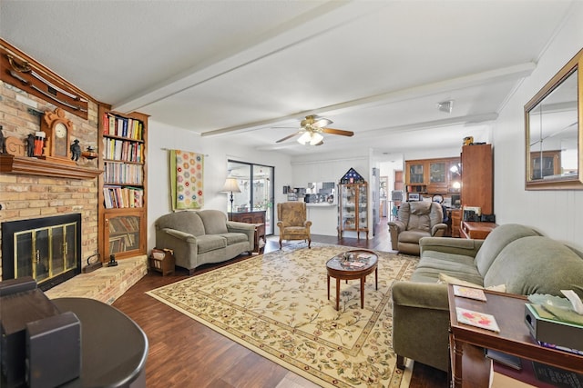 3433 Lawndale Ave, Fort Worth, TX 76133 - living area with beamed ceiling, a brick fireplace, ceiling fan, and wood finished floors
