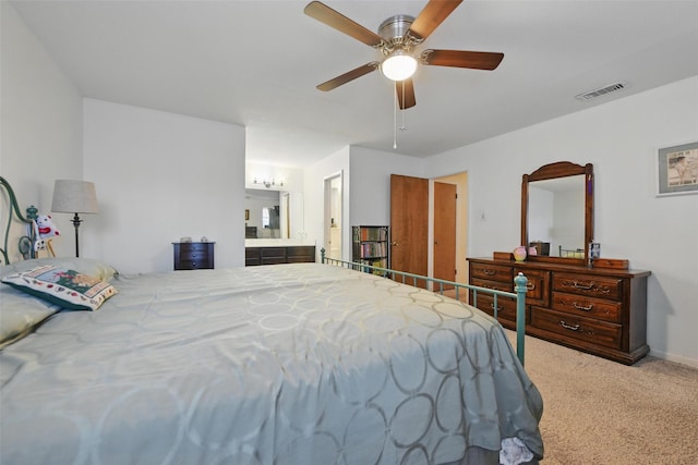 3433 Lawndale Ave, Fort Worth, TX 76133 - carpeted bedroom with visible vents, ensuite bathroom, and a ceiling fan