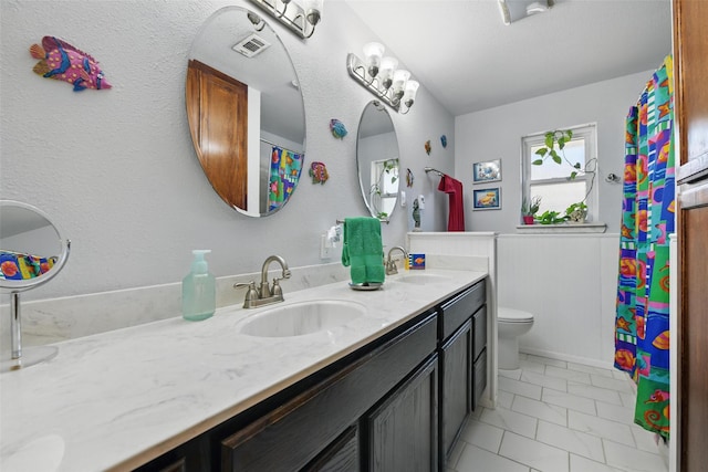 3433 Lawndale Ave, Fort Worth, TX 76133 - full bathroom featuring double vanity, visible vents, toilet, and a sink