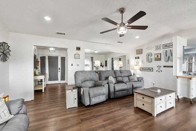 18341 Shore Dr, Kemp, TX 75143 - living area featuring ceiling fan, dark wood-style flooring, a textured ceiling, and visible vents
