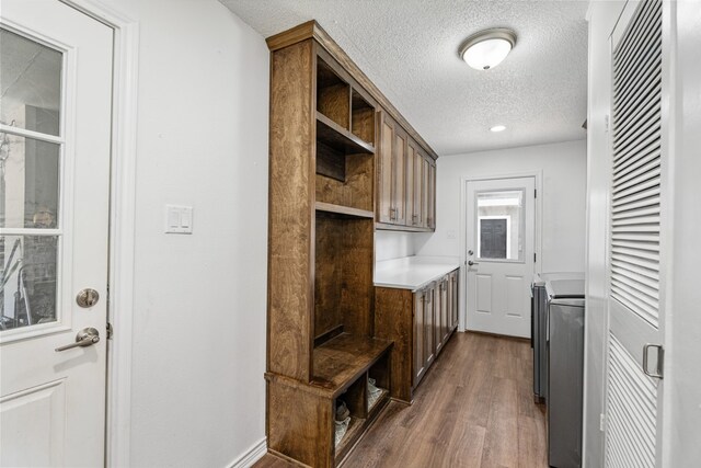 18341 Shore Dr, Kemp, TX 75143 - mudroom with a heating unit, a textured ceiling, and dark wood-style flooring