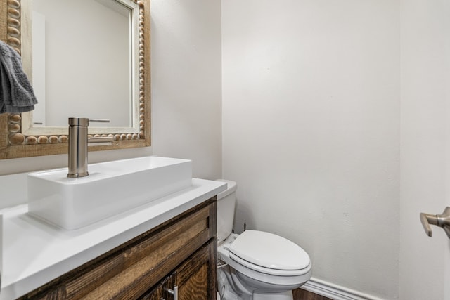 18341 Shore Dr, Kemp, TX 75143 - bathroom featuring vanity, toilet, and wood finished floors