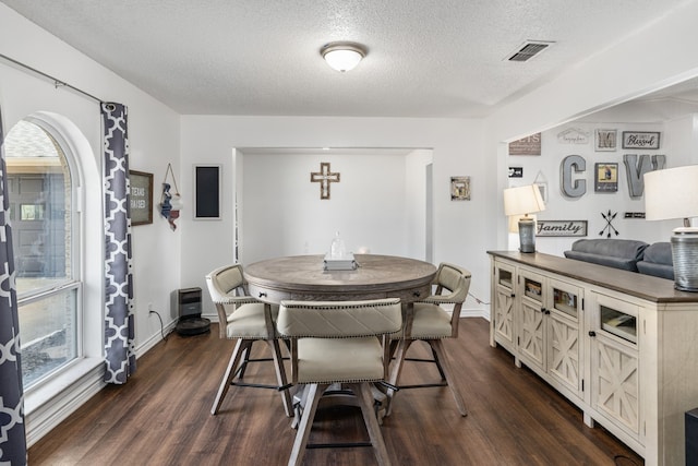 18341 Shore Dr, Kemp, TX 75143 - dining space featuring baseboards, dark wood-style flooring, a textured ceiling, and visible vents