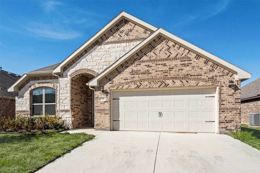 3709 Trillium Dr, Fort Worth, TX 76244 - french country style house featuring brick siding, driveway, and a garage