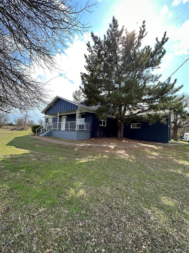 exterior space featuring a front yard and a porch