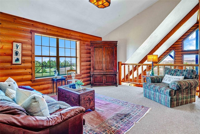 living room with log walls, high vaulted ceiling, and carpet floors