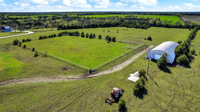 birds eye view of property with a rural view