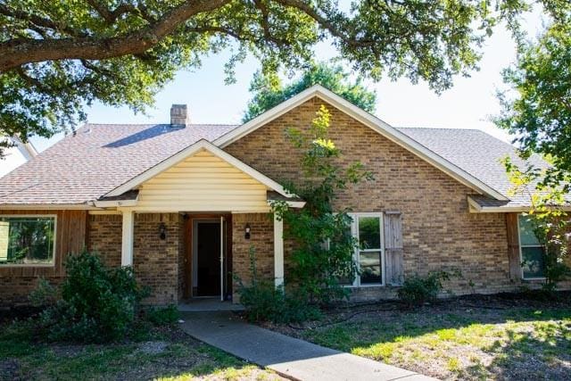4424 Denver Dr, Plano, TX 75093 - single story home with brick siding and a chimney