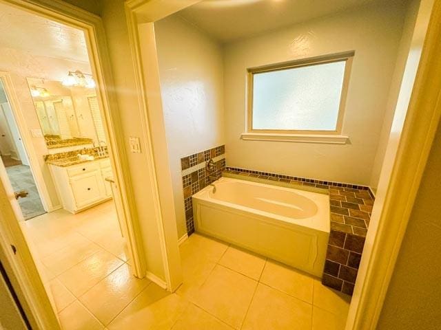 4424 Denver Dr, Plano, TX 75093 - bathroom featuring a bath, tile patterned flooring, and vanity