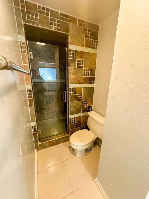 4424 Denver Dr, Plano, TX 75093 - bathroom featuring tile patterned floors, a shower stall, and toilet
