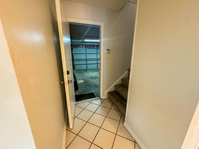 4424 Denver Dr, Plano, TX 75093 - hallway with light tile patterned floors, stairway, and baseboards
