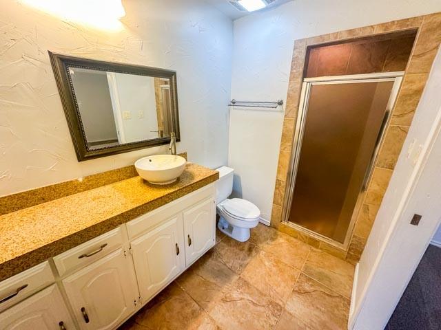 4424 Denver Dr, Plano, TX 75093 - full bath featuring toilet, a stall shower, and vanity