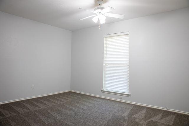 4424 Denver Dr, Plano, TX 75093 - unfurnished room with a ceiling fan, baseboards, and dark carpet