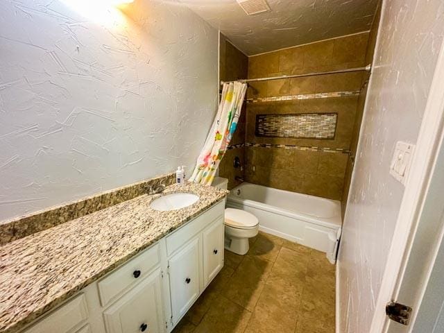 4424 Denver Dr, Plano, TX 75093 - bathroom with toilet, shower / bath combo with shower curtain, vanity, and a textured wall