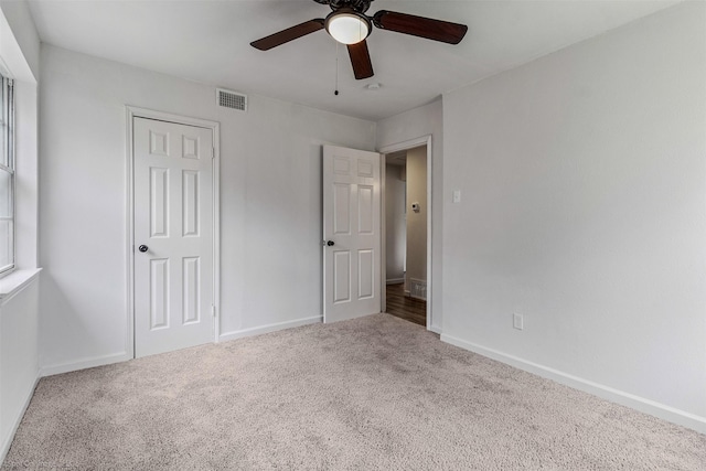 4630 Harvey Dr, Mesquite, TX 75150 - unfurnished bedroom with carpet, baseboards, and ceiling fan