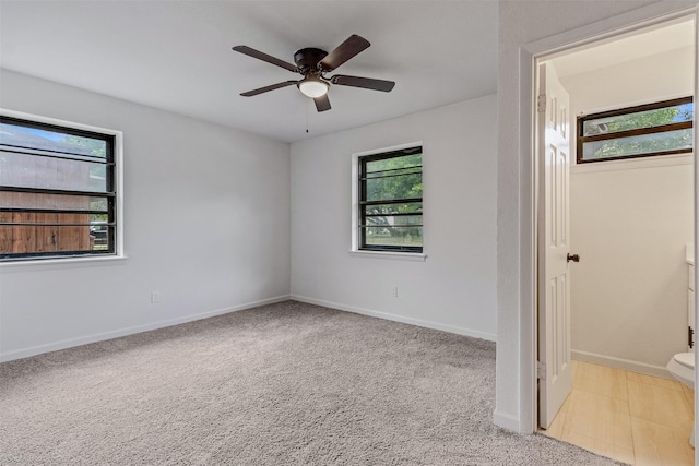 4630 Harvey Dr, Mesquite, TX 75150 - unfurnished bedroom featuring multiple windows, light carpet, and baseboards