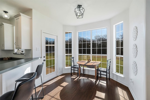 640 County Road 203, Collinsville, TX 76233 - dining room featuring baseboards and wood finished floors