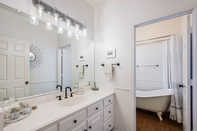 640 County Road 203, Collinsville, TX 76233 - bathroom featuring vanity, a shower with shower curtain, wood finished floors, and a freestanding bath