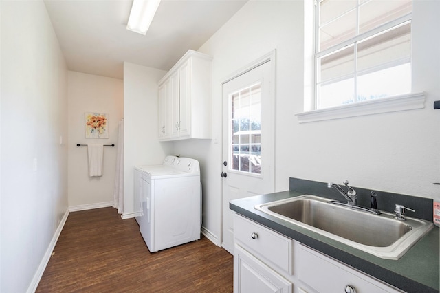 640 County Road 203, Collinsville, TX 76233 - washroom with a sink, washer and dryer, cabinet space, baseboards, and dark wood-style flooring