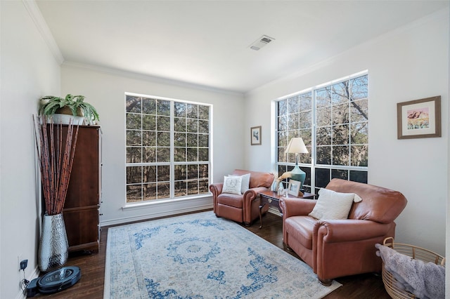 640 County Road 203, Collinsville, TX 76233 - living area with a wealth of natural light, visible vents, crown molding, and dark wood-style flooring