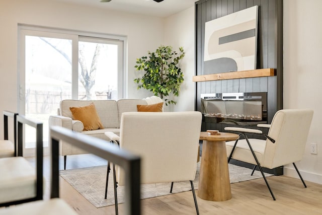 interior space with wood finished floors and ceiling fan
