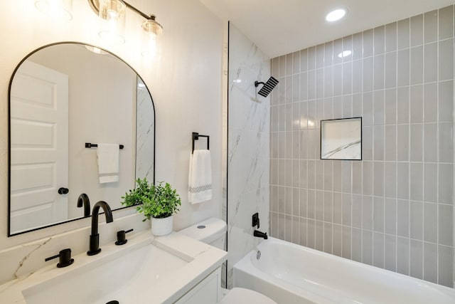 bathroom with recessed lighting, shower / bath combination, toilet, and vanity