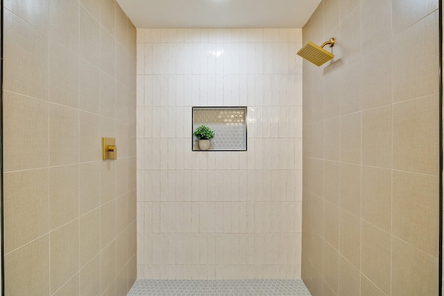 full bath with tiled shower