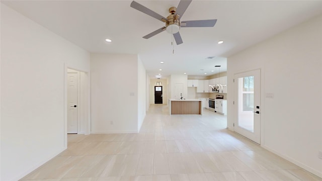 2227 Stoneman St, Dallas, TX 75215 - unfurnished living room with ceiling fan, recessed lighting, and baseboards