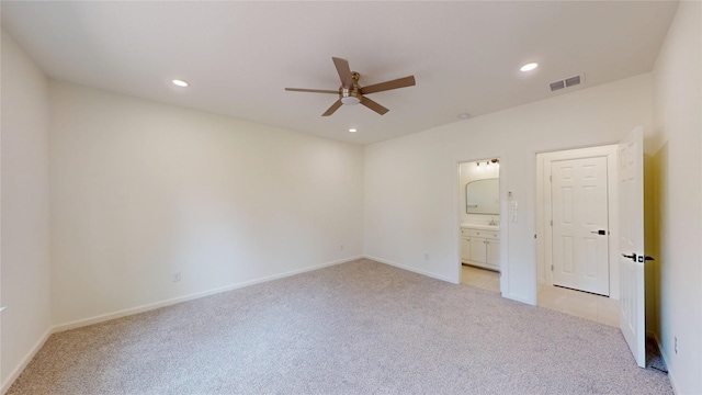 2227 Stoneman St, Dallas, TX 75215 - unfurnished bedroom with light carpet, recessed lighting, ensuite bathroom, baseboards, and a ceiling fan