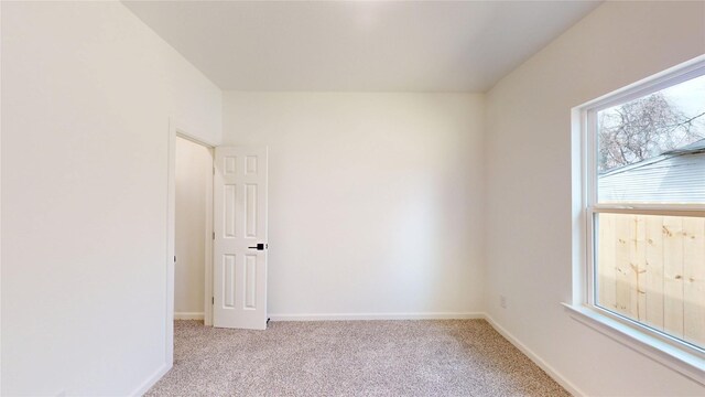 2227 Stoneman St, Dallas, TX 75215 - unfurnished room featuring light colored carpet and baseboards